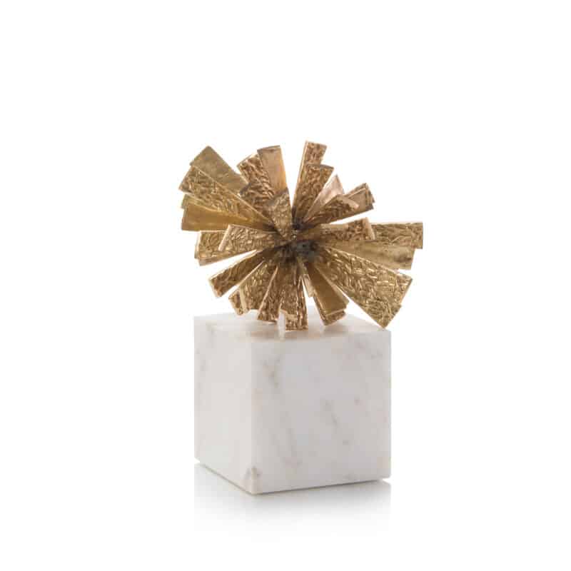 The starbust object is made with brass and marble and works as a gorgeous centrepiece